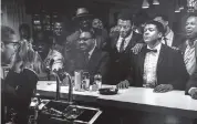  ?? COURTESY OF THE HAMPTON HOUSE ?? Malcolm X, far left, photograph­ing, Jim Brown, Muhammad Ali and Sam Cooke.