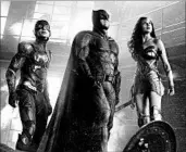  ?? MPAA rating: Running time: WARNER BROS. PICTURES ?? Ezra Miller plays The Flash, from left, Ben Affleck is Batman and Gal Gadot is Wonder Woman in “Justice League.”
PG-13 (for sequences of sci-fi violence and action) 2:01