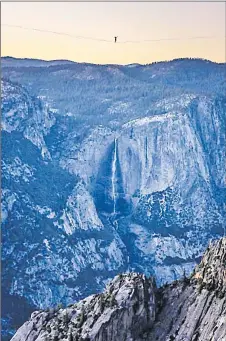  ?? Picture: SCOTT OLLER/SCOTT OLLER FILMS VIA AP ?? In this Saturday on June 12, 2021, photo provided by Scott Oller Films, highliner Daniel Monterrubi­o walks the 2,800-foot-long line off Taft Point above Yosemite Valley in Yosemite, Calif.