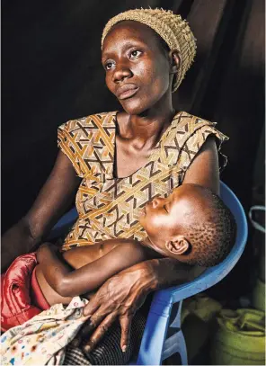  ?? MALIN FEZEHAI FOR THE NEW YORK TIMES ?? Nancy Adhiambo, a Kenyan mother of five, learned she had H.I.V. during her third pregnancy. Last year, she found out two of her children, including her youngest, have H.I.V.