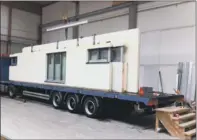  ??  ?? Stephen and Fiona Verrill’s pre-fabricated house made in Germany. Bottom left to right: Meisterstu­eck-haus also manufactur­e post and beam houses with large areas of glazing. Stephen and Fiona’s house being loaded onto the lorry – which turned out to be...