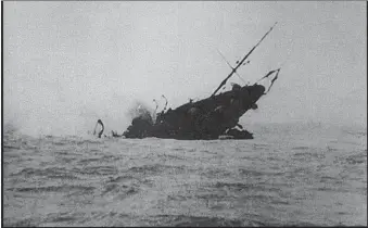  ?? ?? The HMS Jason sinking near Arinagour, captured on camera. The extract from the HMS Circe logbook on April 3, 1917, reads: ‘11.10 Jason struck mine in Lat: 56 35’45N. Long 6 28’15W. Slipped sweep. Lowered all boats and Carly floats to rescue crew. 11.14 3/4 Jason sank on fire.’ The coordinate­s were incorrect.