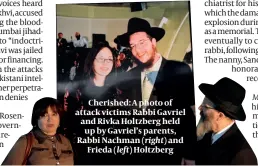  ?? ?? Cherished: A photo of attack victims Rabbi Gavriel and Rivka Holtzberg held up by Gavriel’s parents, Rabbi Nachman (right) and Frieda (left) Holtzberg