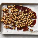  ?? FOOD STYLED BY SIMON ANDREWS. PHOTO BY ARMANDO RAFAEL/THE NEW YORK TIMES ?? Hazelnuts are coated in a homemade caramel before being blended in a food processor to create a praline paste for a Paris-Brest recipe.