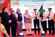  ?? IANS ?? Prime Minister Narendra Modi flags off the first Shimla-Delhi flight under the UDAN scheme at Jubbarhatt­i airport in Shimla on 27 April.