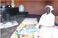  ?? ?? Gogo Jane Zindoga with her blankets and hampers she received from First Lady Dr Auxillia Mnangagwa in Mutasa, Manicaland yesterday