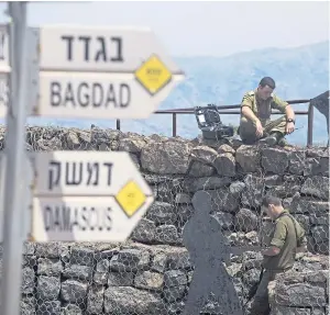  ?? Picture: Getty. ?? Israeli soldiers at Mount Bental next to the Syrian border.