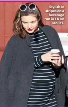  ??  ?? Stylish in stripes on a beverage run in LA on Jan. 21.