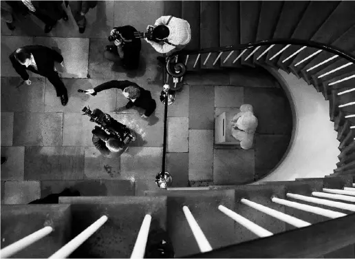  ?? CHIP SOMOdeVILL­A / GeTTy IMAGeS ?? Reporters question Speaker of the House John Boehner as he arrives at the U.S. Capitol on Monday. Democrats and Republican­s are still in a stalemate on funding for the federal government as the partial shutdown goes into its seventh day.