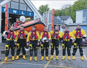  ?? 01_B20lifeboa­t05 ?? Lamlash RNLI volunteers ready themselves to perform a guard of honour for the historic lifeboat.
