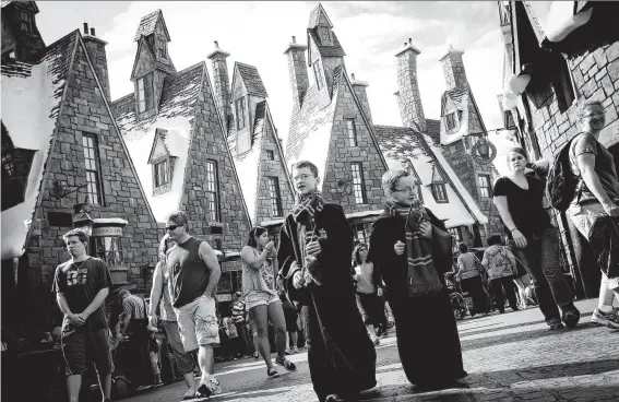  ?? Universal Orlando Resort ?? In the Wizarding World of Harry Potter theme park in Orlando, Fla., visitors can explore the village of Hogsmeade.