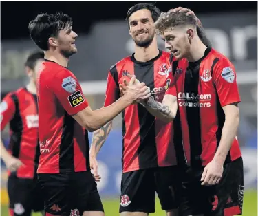  ??  ?? Goal hungry: Jamie McGonigle is congratula­ted after scoring in Crusaders’ rout at Dungannon
