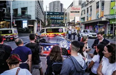  ?? (AP) ?? AUSTRALIA STABBING — A crowd gathers outside Westfield Shopping Center in Sydney, Australia, on Saturday, April 13, 2024. Five people and a suspect were killed in an attack at the mall that left multiple people injured, police said.