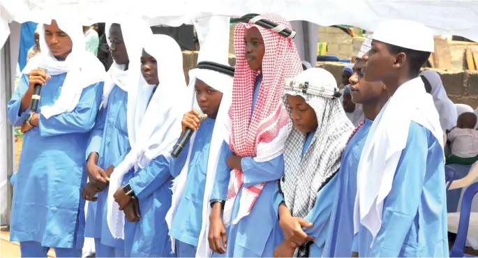  ?? PHOTO
ABUBAKAR YAKUBU ?? Graduands of Sheikh A. M. Gumi Memorial Islamiyya School, reciting verses from the Holy Qur’an in Karu, Abuja on Saturday.