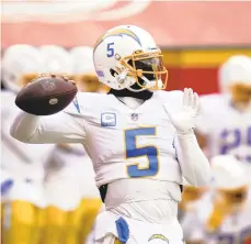  ?? JEFF ROBERSON/AP ?? Los Angeles Chargers quarterbac­k Tyrod Taylor (5) warms up before an NFL football game against the Kansas City Chiefs, Sunday, Jan. 3, 2021, in Kansas City.