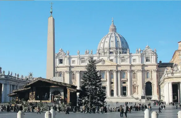  ?? PHOTOS: RICK STEVES ?? The tree lighting in front of St. Peter’s Basilica takes place in mid-December, but the life-size nativity scene isn’t unveiled until Christmas Eve.