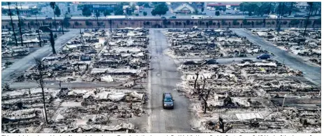  ?? JOSH HANER / NEW YORK TIMES ?? This aerial view shows blocks of burned-down homes Tuesday in the Journey’s End Mobile Home Park in Santa Rosa, Calif. Much of the damage from California’s wildfires was in Santa Rosa, a much larger city than usually finds itself confrontin­g a wildfire.