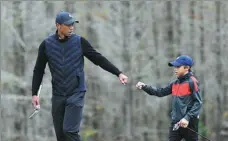  ?? AP ?? Tiger Woods enjoys a round of golf with his son Charlie at a tournament in Orlando, Florida, on Dec 17 last year.