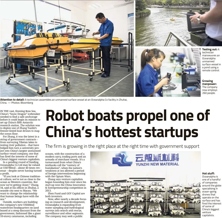  ??  ?? Attention to detail: A technician assembles an unmanned surface vessel at an Oceanalpha Co facility in Zhuhai, China. — Photos: Bloomberg Testing out: A technician manoeuvres an Oceanalpha unmanned surface vessel in a pond using a remote...