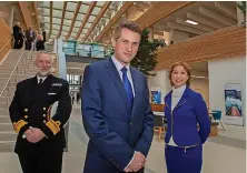  ?? Steve Roberts ?? Then Defence Secretary Gavin Williamson, centre, is escorted through the Hydrograph­ic Office at Taunton by then CEO Rear Admiral Tim Lowe, left, and Rebecca Pow, MP for Taunton during a visit in 2019