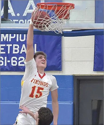  ?? PETE BANNAN — MEDIANEWS GROUP ?? West Chester East’s Andrew Carr dunks in the first quarter of the District 1Class 5A semifinal against West Chester Rustin at Norristown Area High School Wednesday.