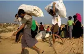 ?? — AP ?? In this file photo, Rohingya refugees, who were staying in no- man’s land at Bandarban between Myanmar and Bangladesh border, arrive at Balukhali refugee camp near Cox’s Bazar, Bangladesh.