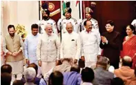  ?? PTI ?? President Ram Nath Kovind, Vice President M. Venkaiah Naidu and Prime Minister Narendra Modi pose with new members of the cabinet