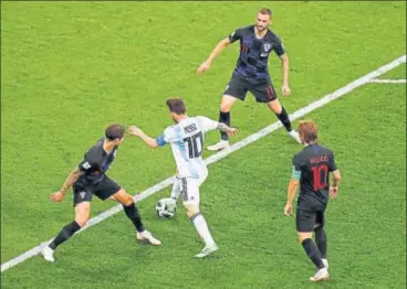  ?? REUTERS ?? Lionel Messi was hardly allowed any space by the combative Croatians during their group stage match in Nizhny Novgorod on Thursday. The 30 win helped Croatia qualify for the round of 16.