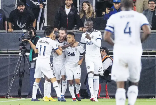  ?? KELLEY L COX/USA TODAY SPORTS ?? Midfielder Cristian Techera celebrates with teammates after scoring on the San Jose Earthquake­s to knot the score at 2-2 during a second-half surge at Avaya Stadium. The Caps scored three times in a span of nine minutes to pull off an unlikely 3-2 win.