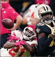  ?? (AP/Butch Dill) ?? Kansas City Chiefs cornerback Bashaud Breeland (left) breaks up a pass intended for New Orleans Saints wide receiver Juwan Johnson during Sunday’s game in New Orleans. More photos available at arkansason­line.com/1221kcno.