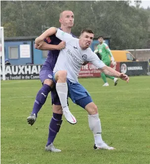  ?? Frank Crook ?? Jamie Rainford making his first league appearance for Ramsbottom United in over two years battling for the ball