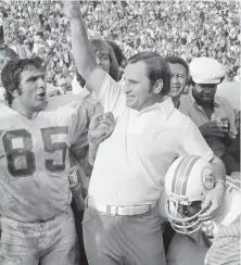  ?? Associated Press 1973 ?? Head coach Don Shula and his Dolphins celebrate the NFL’s only perfect season, capped by a Super Bowl VII victory.