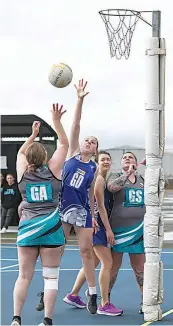  ?? ?? Thorpdale’s Michaela Noble leaps to defends the shot of Toora’s Jade Latham in C grade.