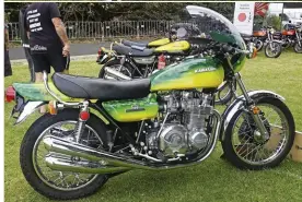  ?? ?? TOP Mick Damon’s stable. His TR500 Suzuki and the ex-Steve Trinder RG500. ABOVE A Z1 Kawasaki “homage” to the movie Stone complete with the signatures of two of the cast members in Hugh “Toad” Keyes-Byrne and Sandy “The Undertaker” Harbutt each side of the tail piece.