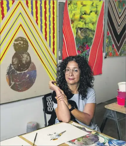  ?? Brian van der Brug Los Angeles Times ?? CAROLYN CASTAÑO in her Eastside studio with her paintings based on ruanas, the humble ponchos of Colombia.