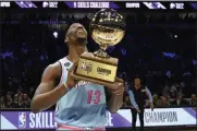  ?? DAVID BANKS — THE ASSOCIATED PRESS ?? Miami Heat’s Bam Adebayo holds the trophy after winning NBA basketball’s All-Star Skills Challenge on Feb. 15, 2020, in Chicago.