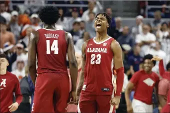  ?? BUTCH DILL — THE ASSOCIATED PRESS ?? Alabama forward Nick Pringle (23) reacts after they beat Auburn in an NCAA college basketball game, Saturday, Feb. 11, 2023, in Auburn, Ala.