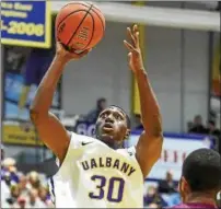  ??  ?? University at Albany’s Travis Charles goes up for a shot against Colgate in this Nov. 15, 2015 photo.