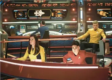  ?? MARNI GROSSMAN/PARAMOUNT+ ?? Rebecca Romijn, from left, as Una, Ethan Peck as Spock, background, Melissa Navia as Ortegas and Anson Mount as Pike in the series “Star Trek: Strange New Worlds,” which recently concluded its first season.