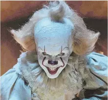  ??  ?? NO FUNNY BUSINESS: Bill Skarsgard, above, portrays an evil clown who preys on children, including Finn Wolfhard, top, in the film version of Stephen King’s ‘It.’