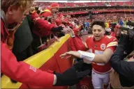  ?? CHARLIE RIEDEL - THE ASSOCIATED PRESS ?? Kansas City Chiefs quarterbac­k Patrick Mahomes (15) celebrates with fans after an NFL football game against the Los Angeles Chargers, Sunday, Dec. 29, 2019, in Kansas City, Mo.