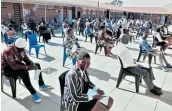  ?? Pictures: LULAMILE FENI / SINO MAJANGAZA ?? READY: Grade 12 pupils and parents at St Johns College in Mthatha are taken through an orientatio­n programme. Parents expressed satisfacti­on with the environmen­t.