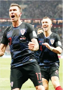  ?? (AP) ?? Croatia's Mario Mandzukic celebrates after scoring his side's second goal during the semifinal match between Croatia and England at the FIFA soccer World Cup in the Luzhniki Stadium in Moscow, Russia Wednesday.