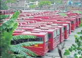  ?? BURHAAN KINU/HT PHOTO ?? Delhi Transport Corporatio­n buses parked at a depot in Okhla, n during the lockdown to curb Covid-19 spread.