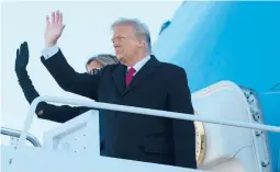  ?? ALEX EDELMAN/GETTY-AFP ?? President Trump and first lady Melania Trump step aboard Air Force One at Joint Base Andrews in Maryland before Joe Biden’s inaugurati­on Wednesday.