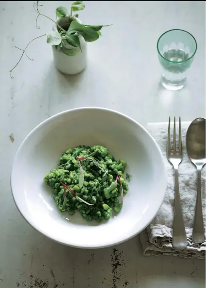  ??  ?? Left Asparagus risotto with wild-garlic pesto. Below Lady Bamford in the Daylesford market garden in Gloucester­shire, with her dog, Bellini