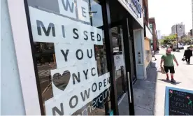  ?? Photograph: Justin Lane/EPA ?? A person walks past a skincare store as more businesses reopen in New York City this month.