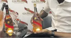  ??  ?? Each bottle of Usain Bolt GH Mumm Olympe Rosé bears the Olympian’s signature.