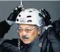  ??  ?? Mayor Ed Lee, above, suits up for his ride on an Oracle Team USA catamaran with the crew, top, practicing for the races this week.