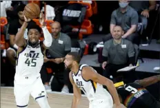  ?? Associated Press ?? OT Thriller Utah Jazz guard Donovan Mitchell (45) scored 57 points Monday, but it wasn’t enough as the Denver Nuggets escaped with Game 1.